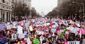 crowd of people holding placards